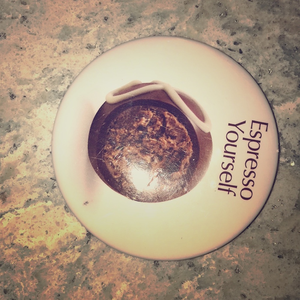 White pin food on it text says “expresso Yourself”